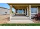 Charming covered deck with a seating area and a view of the backyard at 7426 E 148Th Pl, Thornton, CO 80602