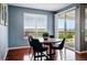 Eat-in dining area with hardwood floors, plenty of light, and slider to the backyard at 7426 E 148Th Pl, Thornton, CO 80602
