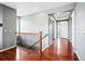 Inviting foyer features hardwood floors, neutral paint, and staircase at 7426 E 148Th Pl, Thornton, CO 80602