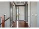Inviting foyer features hardwood floors, neutral paint, and a stylish front door with sidelight at 7426 E 148Th Pl, Thornton, CO 80602
