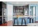 Stylish kitchen with stainless steel appliances, granite countertops, and breakfast bar seating at 7426 E 148Th Pl, Thornton, CO 80602