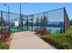 Well-maintained tennis courts featuring a secure gate entrance and manicured landscaping at 7426 E 148Th Pl, Thornton, CO 80602