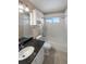 Bathroom featuring a tub with a shower, a sink, and a vanity at 10606 Cottoneaster Way, Parker, CO 80134