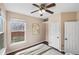 Cozy bedroom with a ceiling fan, a cream bedspread, and neutral wall art at 10606 Cottoneaster Way, Parker, CO 80134