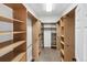 Spacious walk-in closet with custom shelving and ample storage space at 10606 Cottoneaster Way, Parker, CO 80134