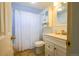 Clean bathroom with a shower/tub combo, vanity, and toilet at 800 W Belleview Ave # 407, Englewood, CO 80110