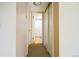 Hallway with carpet, doors to bathroom and closets at 800 W Belleview Ave # 407, Englewood, CO 80110