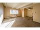 Living room with carpet, large window, and a ceiling fan at 800 W Belleview Ave # 407, Englewood, CO 80110