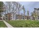 A view of the exterior of the apartment building with brick and painted wood at 14437 E 1St Dr # C09, Aurora, CO 80011