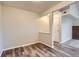 A sunny living room with wood floors, neutral walls, and a view into another room with a brick fireplace at 14437 E 1St Dr # C09, Aurora, CO 80011