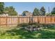 Landscaped backyard with garden and wooden fence at 3560 N Columbine St, Denver, CO 80205