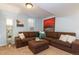 Finished basement with sectional sofa, large artwork, and ample space at 3560 N Columbine St, Denver, CO 80205