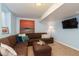 Finished basement with sectional sofa and tv at 3560 N Columbine St, Denver, CO 80205