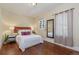 Cozy bedroom with hardwood floors and a full-size bed at 3560 N Columbine St, Denver, CO 80205