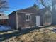 Brown detached garage with a single door and window at 3560 N Columbine St, Denver, CO 80205