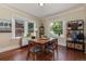 Bright dining room with hardwood floors, large windows, and coat rack at 3560 N Columbine St, Denver, CO 80205