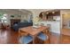 Bright dining room features hardwood floors and a mid-century modern dining set at 3560 N Columbine St, Denver, CO 80205