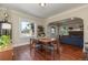 Bright dining room with hardwood floors, large windows, and coat rack at 3560 N Columbine St, Denver, CO 80205