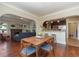 Bright dining room features hardwood floors and a mid-century modern dining set at 3560 N Columbine St, Denver, CO 80205