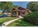 Updated brick home with a welcoming front porch and landscaping at 3560 N Columbine St, Denver, CO 80205