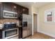 Modern kitchen with stainless steel appliances and granite countertops at 3560 N Columbine St, Denver, CO 80205