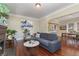 Open living room with hardwood floors, fireplace and adjacent dining area at 3560 N Columbine St, Denver, CO 80205