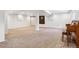 Unfinished basement with neutral carpet, white walls and exposed ceiling at 94 Spring Ln, Boulder, CO 80302