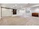 Spacious finished basement with carpet, piano, and dartboard area offers versatile living space at 94 Spring Ln, Boulder, CO 80302
