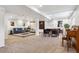 Spacious finished basement with multiple seating areas and carpet flooring at 94 Spring Ln, Boulder, CO 80302