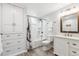 Well-lit bathroom with white cabinets, shower/tub combination, and neutral finishes creates a calming atmosphere at 94 Spring Ln, Boulder, CO 80302