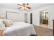 Bedroom featuring neutral carpet, ceiling fan and ensuite bathroom at 94 Spring Ln, Boulder, CO 80302