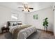 Bedroom featuring neutral decor, a ceiling fan and large windows at 94 Spring Ln, Boulder, CO 80302