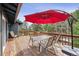 Relax on the deck, featuring a table, chairs and umbrella and enjoy beautiful scenery at 94 Spring Ln, Boulder, CO 80302