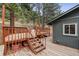 Multiple wooden decks, set amongst towering pine trees, provide ample space for relaxing and entertaining outdoors at 94 Spring Ln, Boulder, CO 80302