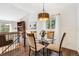 Bright dining area with elegant lighting and views to the deck, creating a welcoming space at 94 Spring Ln, Boulder, CO 80302
