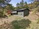 Exterior view of house with deck, situated among trees at 94 Spring Ln, Boulder, CO 80302