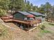 Rear exterior of home featuring a large deck, perfect for outdoor entertaining and relaxation at 94 Spring Ln, Boulder, CO 80302