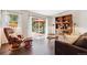 Comfortable living room with a walk-out to a deck and stylish furnishings at 94 Spring Ln, Boulder, CO 80302