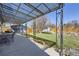 Backyard under a metal shade structure features a lush lawn and an outdoor kitchen at 11123 Clermont Dr, Thornton, CO 80233