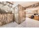 Spacious basement with unique wood paneling detail and neutral carpeting at 11123 Clermont Dr, Thornton, CO 80233