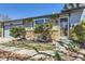 Well-kept home with stone and siding, landscaped garden beds, and welcoming entrance at 11123 Clermont Dr, Thornton, CO 80233