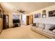 Spacious living room with carpet flooring and a large window that lets in lots of natural light at 11123 Clermont Dr, Thornton, CO 80233