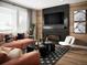 Spacious living room features a comfortable sectional sofa and a modern fireplace at 2515 W 69Th Pl, Denver, CO 80221