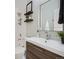 The bathroom features modern fixtures, floating shelves, and a neutral color palette at 9430 Carr St, Westminster, CO 80021