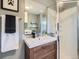 The bathroom features modern fixtures, a shower stall, and a neutral color palette at 9430 Carr St, Westminster, CO 80021