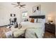 This primary bedroom has wood floors, a ceiling fan and a desk for working at 9430 Carr St, Westminster, CO 80021