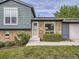 Charming home exterior with brick accents, well-maintained lawn, and inviting entryway at 9430 Carr St, Westminster, CO 80021