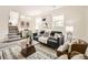 Inviting living room with a comfortable seating area, a staircase, and stylish decor at 9430 Carr St, Westminster, CO 80021