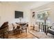 Cozy seating area and dining space with modern art, area rug and large picture window at 9430 Carr St, Westminster, CO 80021