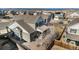 Aerial view of a suburban home showcasing the backyard, patio, and surrounding neighborhood at 1698 Odyssey Ct, Castle Rock, CO 80109